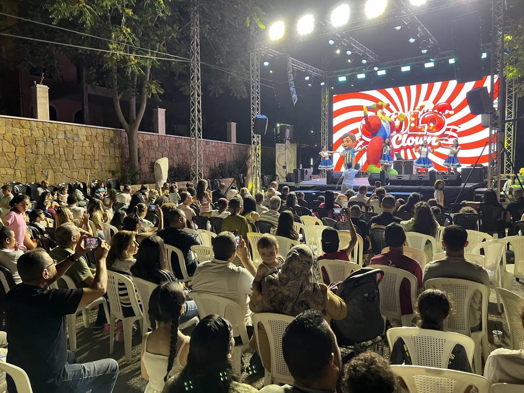 A large outdoor audience enjoying a Calinou festival