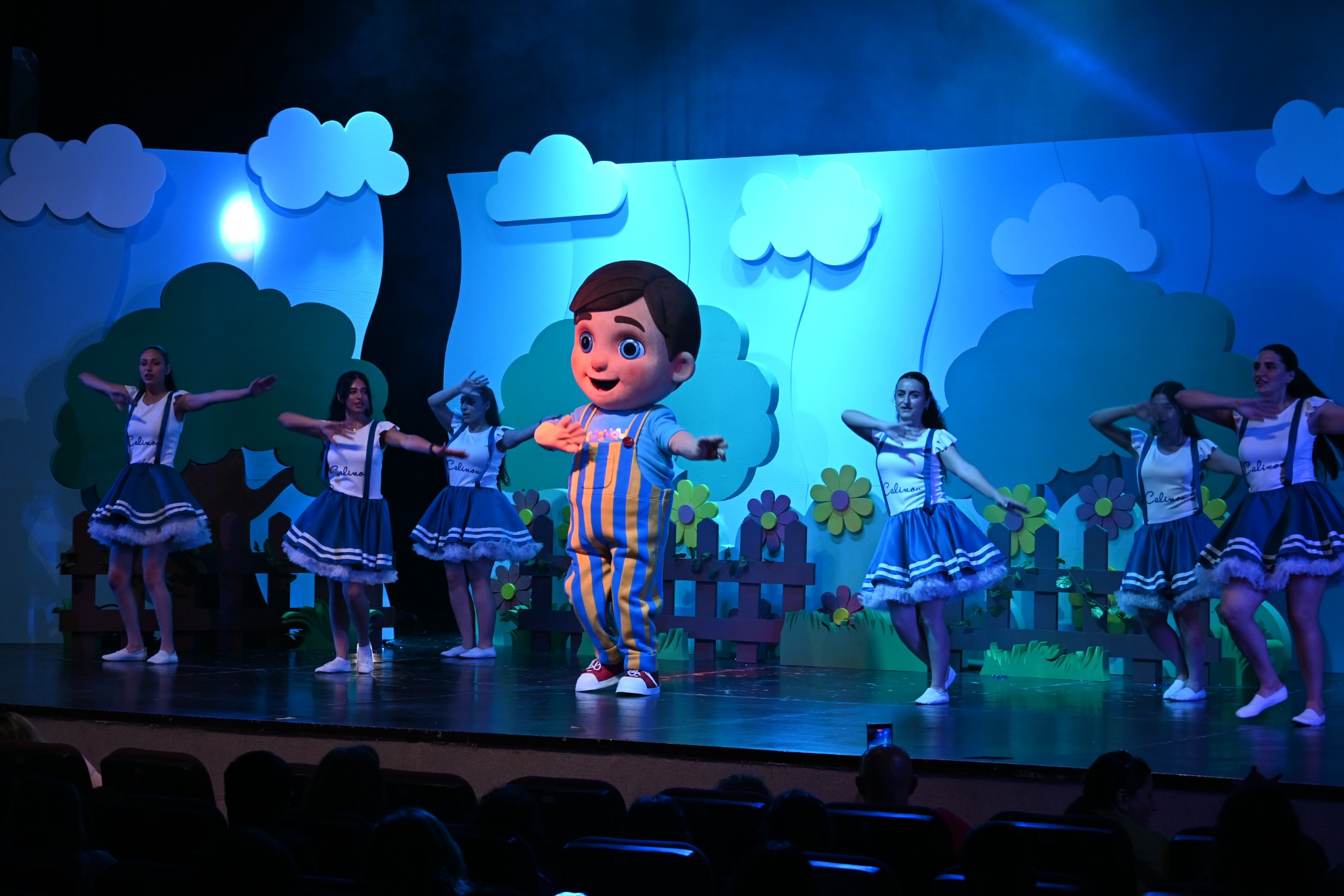 Calinou and his professional team performing a colourful stage show